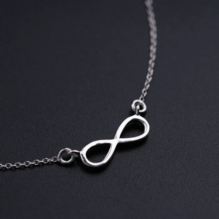 Close-up of the 925 Sterling Silver Infinity Pendant by Eraya Jewel, highlighting its high-polish finish and fine craftsmanship