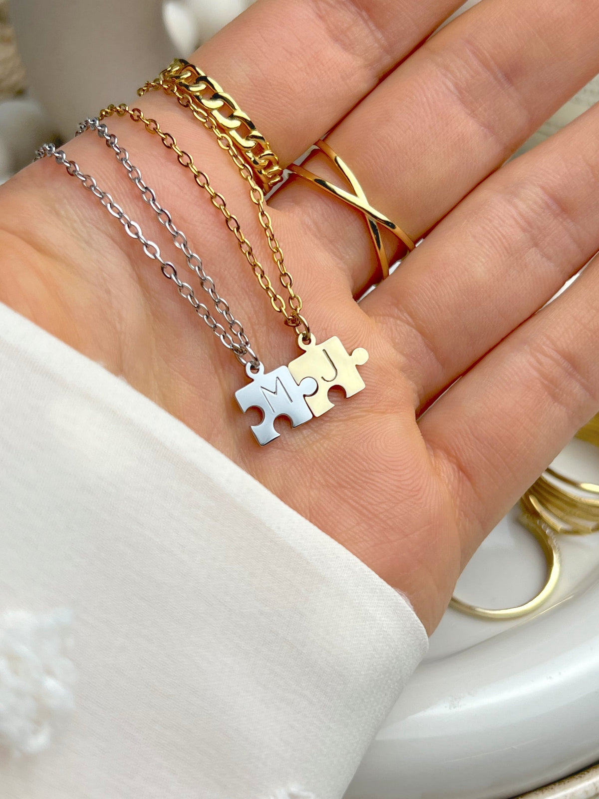 You Complete Me matching gold and silver puzzle pendants for couples